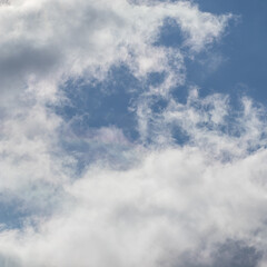 Background of blue sky with white clouds
