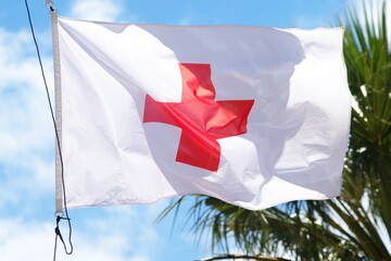 Red Cross on White Flag as first Aid Sign