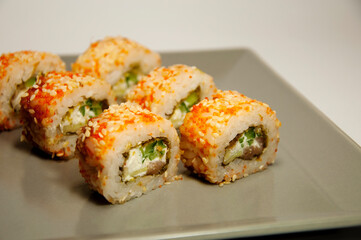 Asian food sushi rolls on a gray plate. High quality photo