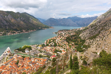 Fototapeta na wymiar Top view of old town Kotor and Boka Kotorska bay on the Adriatic sea in summer day.
