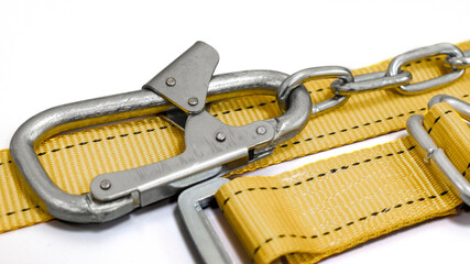 Safety belt for work at height with carabiner. Professional safety equipment for mountaineering and...