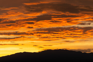 Sunset behind a mountain