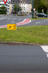 Yellow traffic sign for redirection on urban streets forces navigation system to calculate a new...