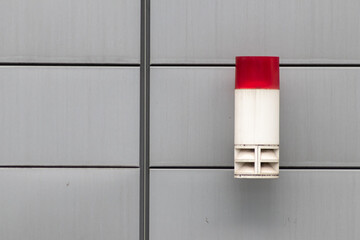 Red external burglar alarm system light as theft protection and burglar prevention and security and...