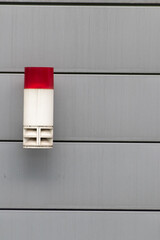 Red external burglar alarm system light as theft protection and burglar prevention and security and safety mechanism for crime detection and police calling in case of urgent emergency red siren light