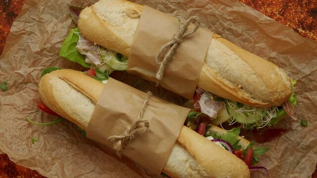 Tasty homemade sandwiches Baguettes with various healthy ingredients. Breakfast take away concept