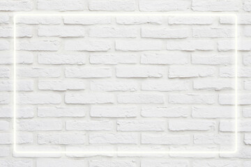 Background texture of empty white retro brick wall with neon light lamp frame