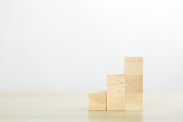Stack wooden block cube, successful growing business concept.