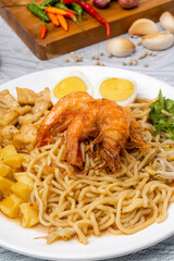 Mie rebus medan or Noodle Soup 

The dish is made of yellow egg noodles, which are also used in Hokkien mee, with a spicy slightly sweet curry-like gravy. The gravy is made from shrimp or tauchu broth