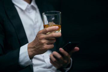 Business people sit whiskey holding whiskey, a restaurant