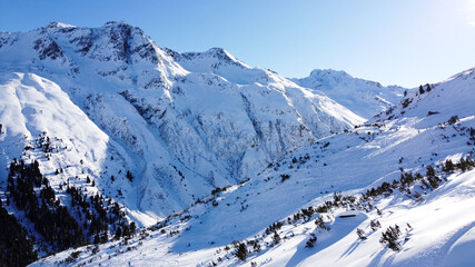 Fototapeta na wymiar Mountain in Galtür covert with snow with a ski slope. This photo is taken in Galtür that is in Tirol Austria.