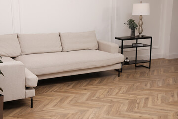 Modern living room with parquet flooring and stylish furniture