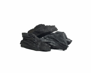 A pile of wooden black charcoal isolated on white background