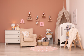 Baby room interior with stylish furniture and comfortable crib © New Africa