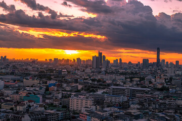 The high angle background of the city view with the secret light of the evening, blurring of night lights, showing the distribution of condominiums, dense homes in the capital community