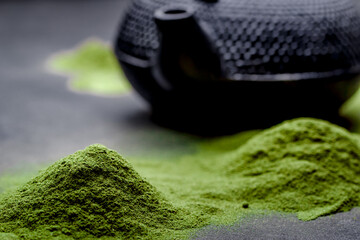 Matcha green tea on black background