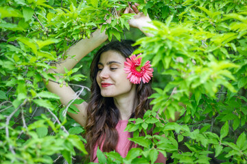 portrait of a woman with flower, portrait of a pretty woman in the garden