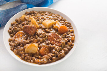 Spanish lentils with potatoes, carrot and chorizo