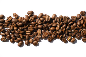 Isolated roasted coffee beans in harsh light