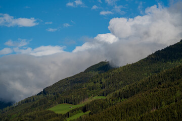 Obraz premium beautiful wide view in the mountains on a sunny spring day with clouds