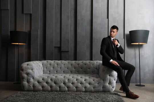 Handsome businessman in stylish living room. Luxury lifestyle