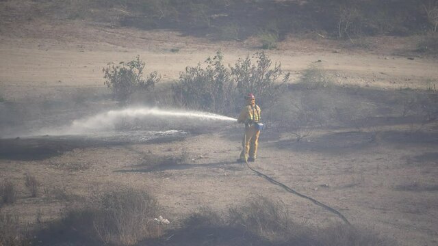 firefighter putting out fire hd
