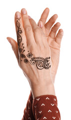 Woman with henna tattoo on hand against white background, closeup. Traditional mehndi ornament