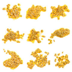 Set with passion fruit seeds on white background, top view