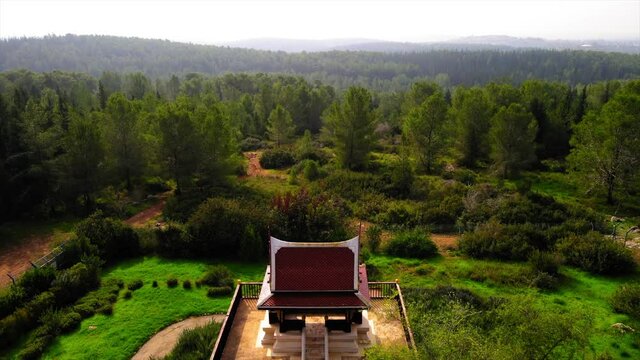 Aerial Forward Shot Of Thai Pagoda, Drone Flying Over Ben Shemen Forest