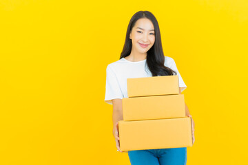 Portrait beautiful young asian woman with box ready for shipping