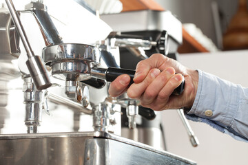 Close-up of espresso preparing in coffee machine, selective focus