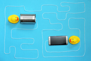 Tin Can Phone With String and Smartphone and Toy Ducks