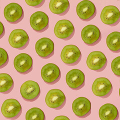 Fototapeta premium fresh green fruit on a pink background.trendy pattern summer concept