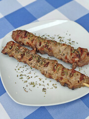 Greek traditional food with meat and vegetables in blue plate trendy cuisine modern background high quality print
