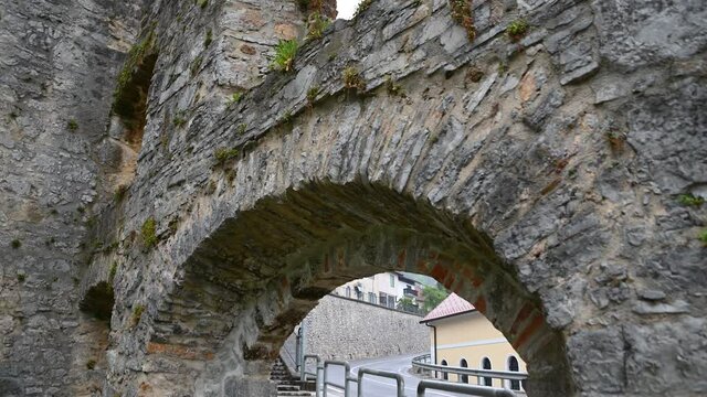 Ruins of an old blast furnace in village Dvor, Slovenia. Only walls remained. Ruins of mighty ironworks. Close up view of stones and bricks. Tilt down
