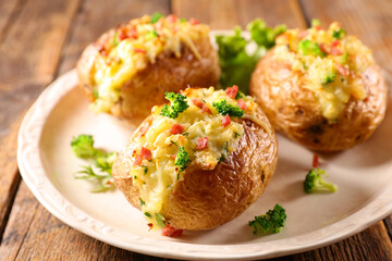 baked potato with cream and vegetable