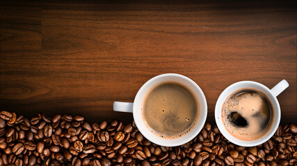 Cup of coffee with coffee beans on table