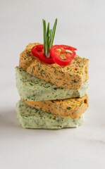 Homemade butter with herbs, rosemary, garlic, onions and butter with papper lying on top of each other