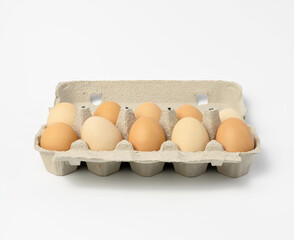 fresh whole brown eggs in paper packaging