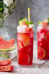 Summer watermelon refreshing drink with lime and soda. Delicious cocktail cold fruit drink.