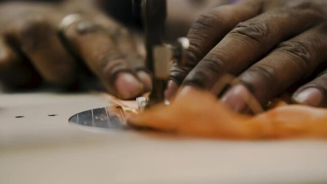 Hands Of Tailor Using Sewing Machine In Tekka Centre, Singapore - close up shot