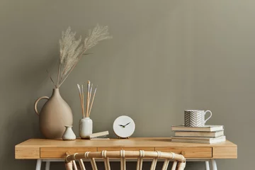 Fotobehang Boho Interieurontwerp van neutraal bohemien woonkamerinterieur met stijlvol bureau, fauteuil, gedroogde bloemen in vaas, boek, decoratie, kantoorbenodigdheden, kopieerruimte, notities en persoonlijke accessoires. Sjabloon.  © FollowTheFlow