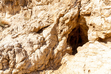 The Wadi Caves in Valley of the Caves in Mleiha Archaeological Centre, Al Faya Mountains, Sharjah. Neolithic limestone caves in United Arab Emirates.