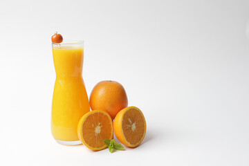 Bottle with fresh orange juice and mint.
