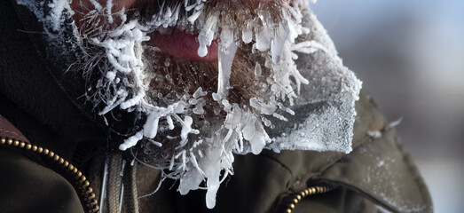 Extremely severe frosts cover people with icicles. Cold weather and climate change in winter....