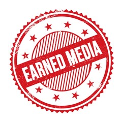 EARNED MEDIA text written on red grungy round stamp.