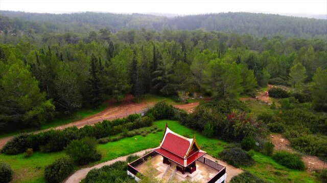 Aerial Shot Of Thai Pagoda, Drone Flying Over Trees In Ben Shemen Forest