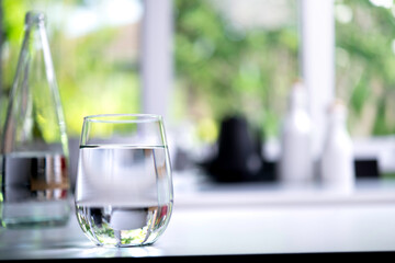 Glass of drinking water on table in kitchen © amenic181