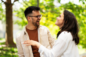 Happy young couple outdoors. Loving couple walking in the city