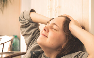 Fototapeta premium Young girl lost hope and holding her head, tired and upset unhappy freelancer after failure at work concept